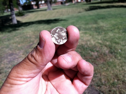 dirty silver dime at the park